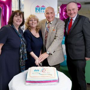 Celebrating 15 years in business - cake cutting photo